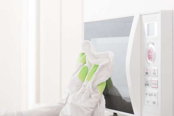 Use a soft cloth to clean the microwave door